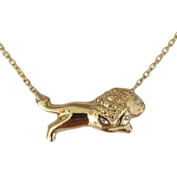 Gold casting from ancient lion artifact. Fine gold necklace with diamond accent.