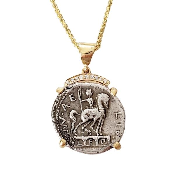 Ancient silver coin from the Roman Republic 114 BC Horse and rider statue on top of a triple arch. 18kt gold setting with a crown of pave diamonds.