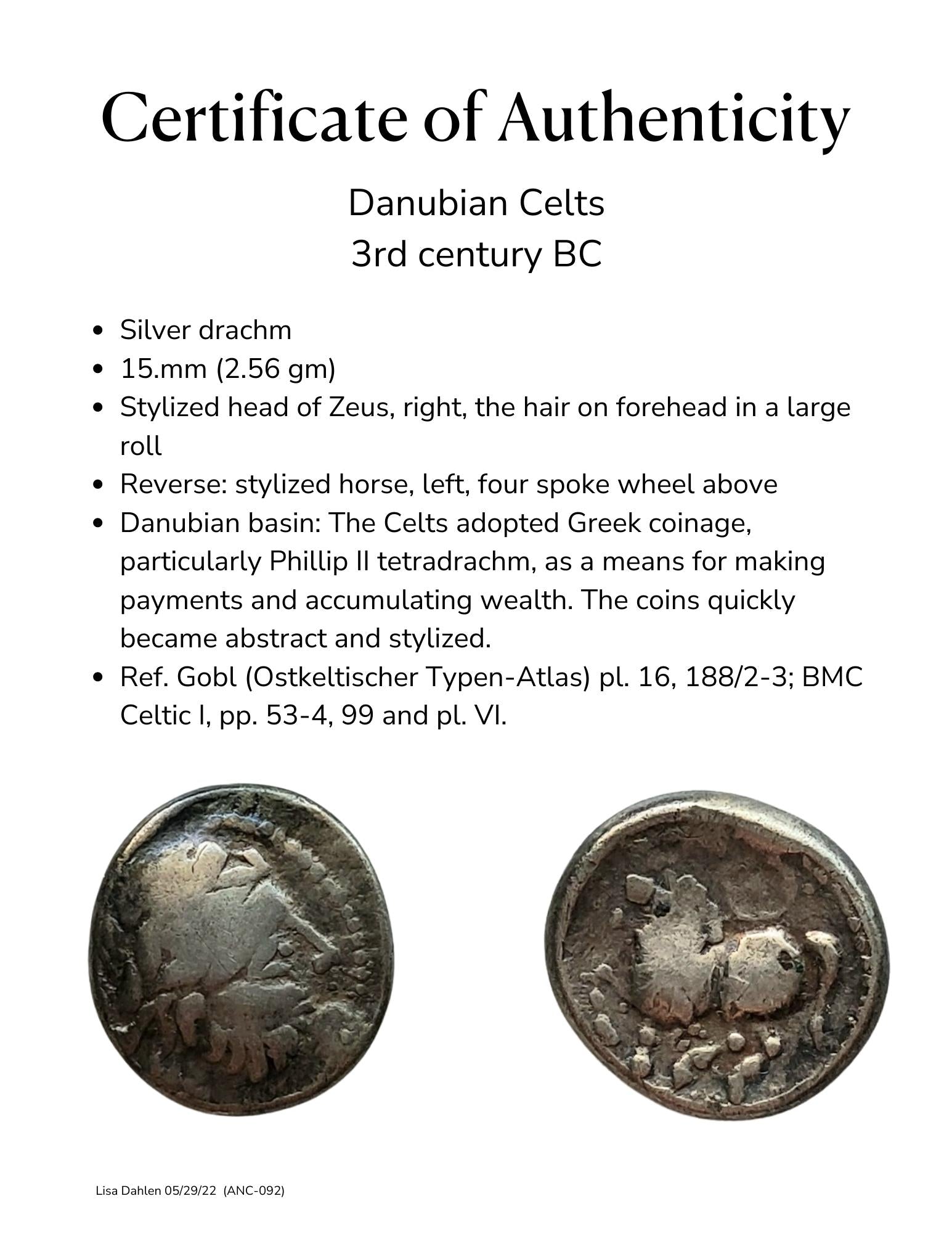 Ancient celtic silver coin of a stylized horse and zeus, certificate.
