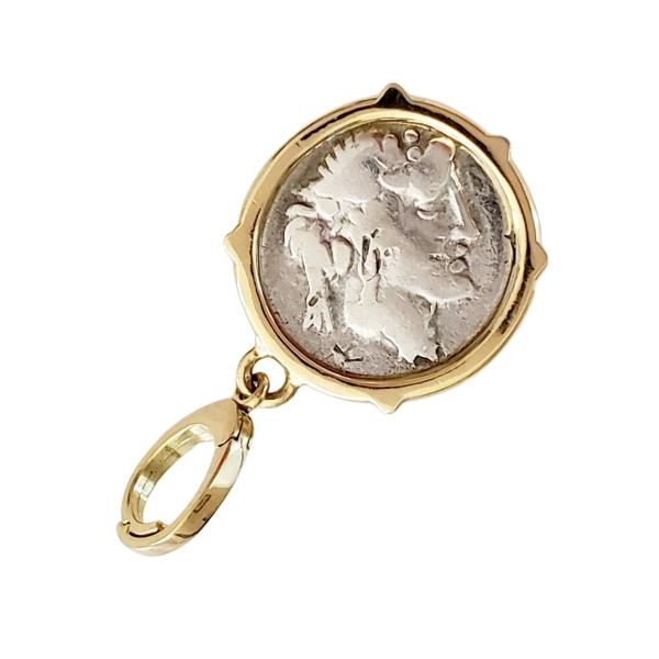 Ancient Roman Republic silver coin Titius Pegasus shown with Bacchus on back. Coin is tilted to show Bacchus image upright