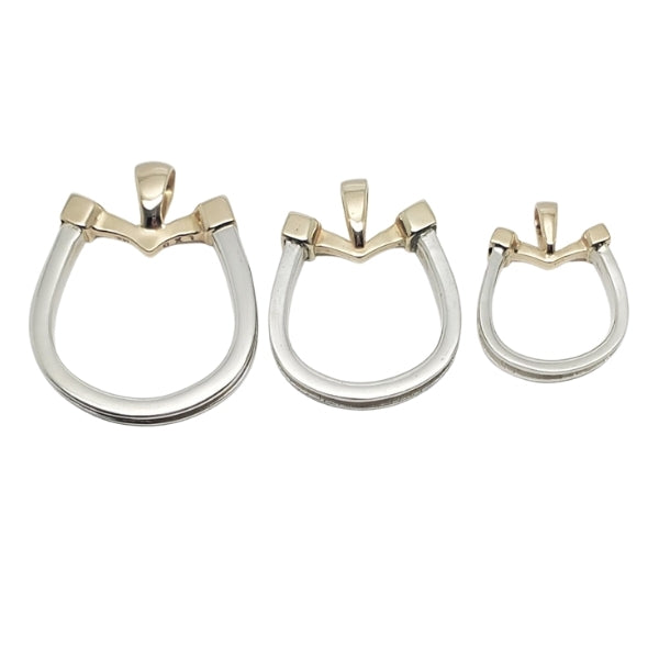 Horseshoe pendant in gold and silver with horsehair braid. Small, medium, and large.