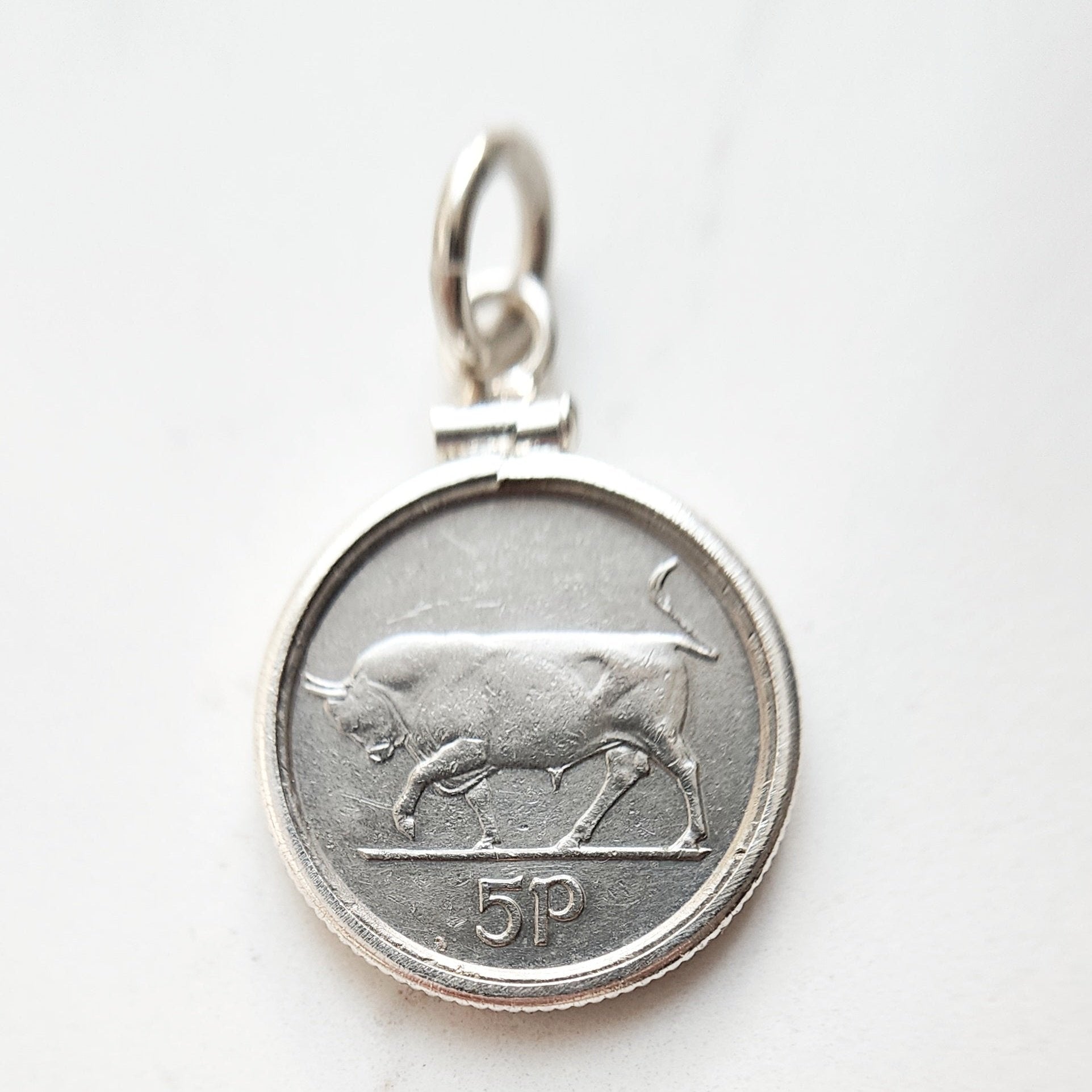 Irish 5pence coin of a bull set in sterling silver coin mount