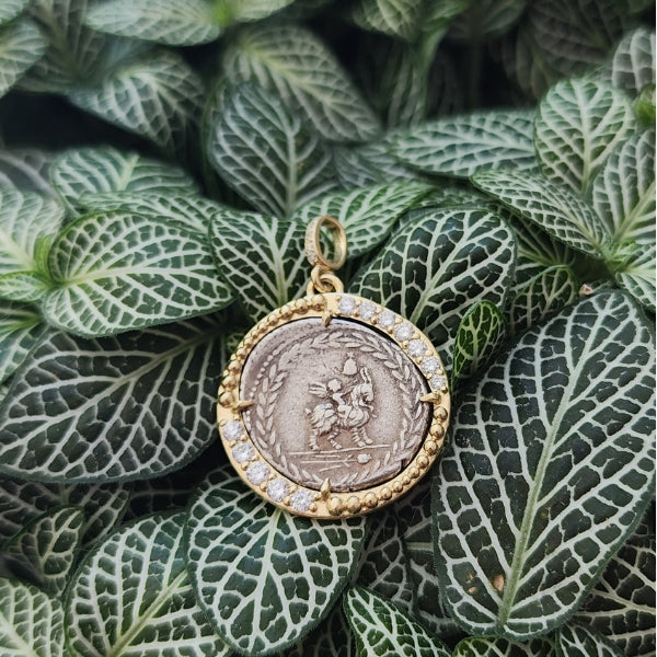 Ancient Roman Republic silver coin of winged genius sitting on a goat 18kt gold and diamond pendant with Apollo on reverse